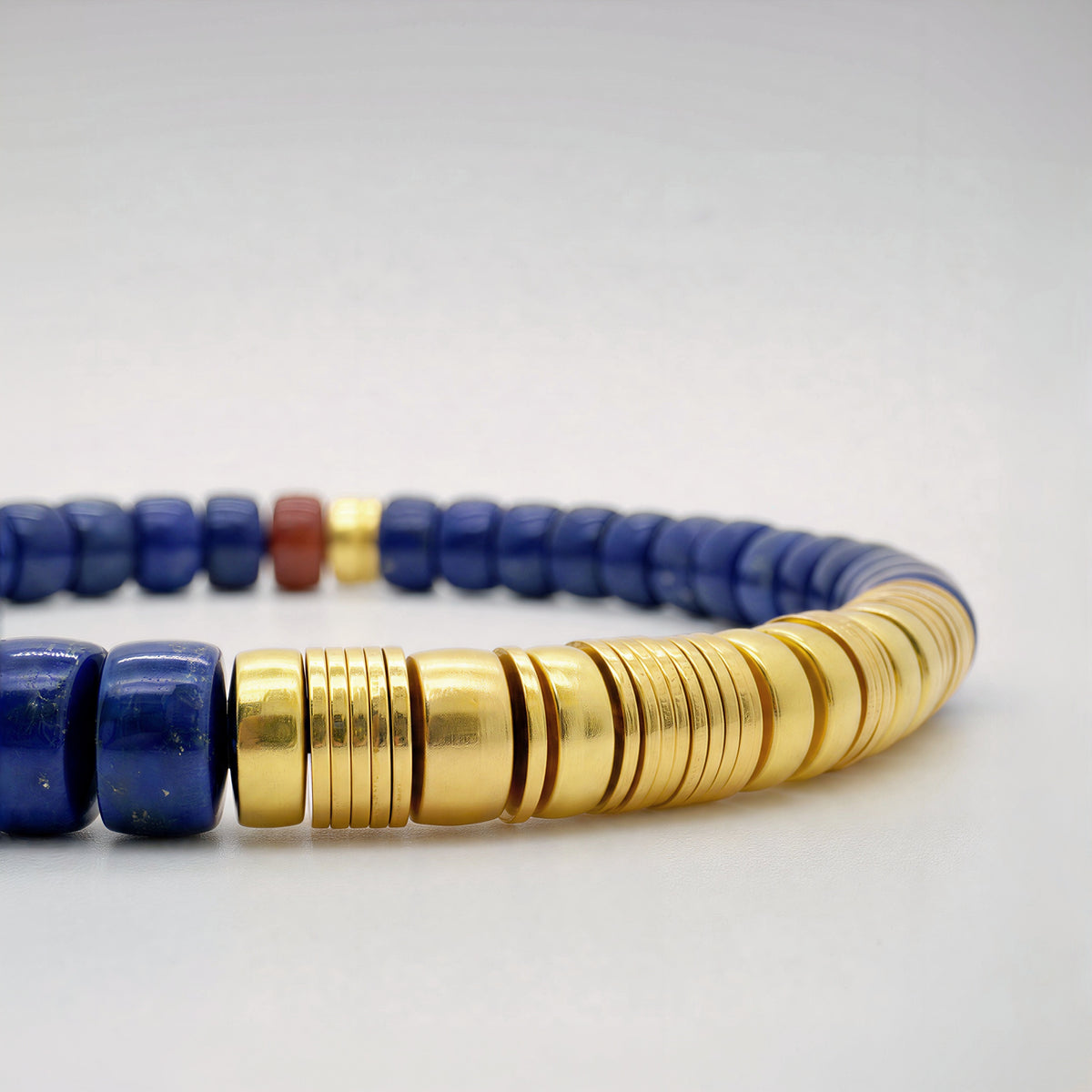Close-up of Astrum 01 lapis lazuli bracelet with red agate and gold vermeil details