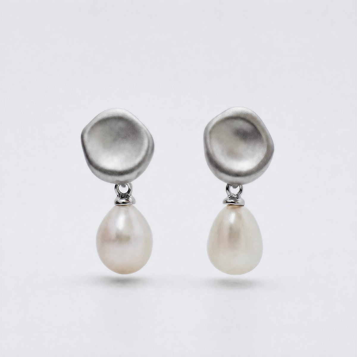 Falling Dew sterling silver and freshwater pearl earrings by ORIN