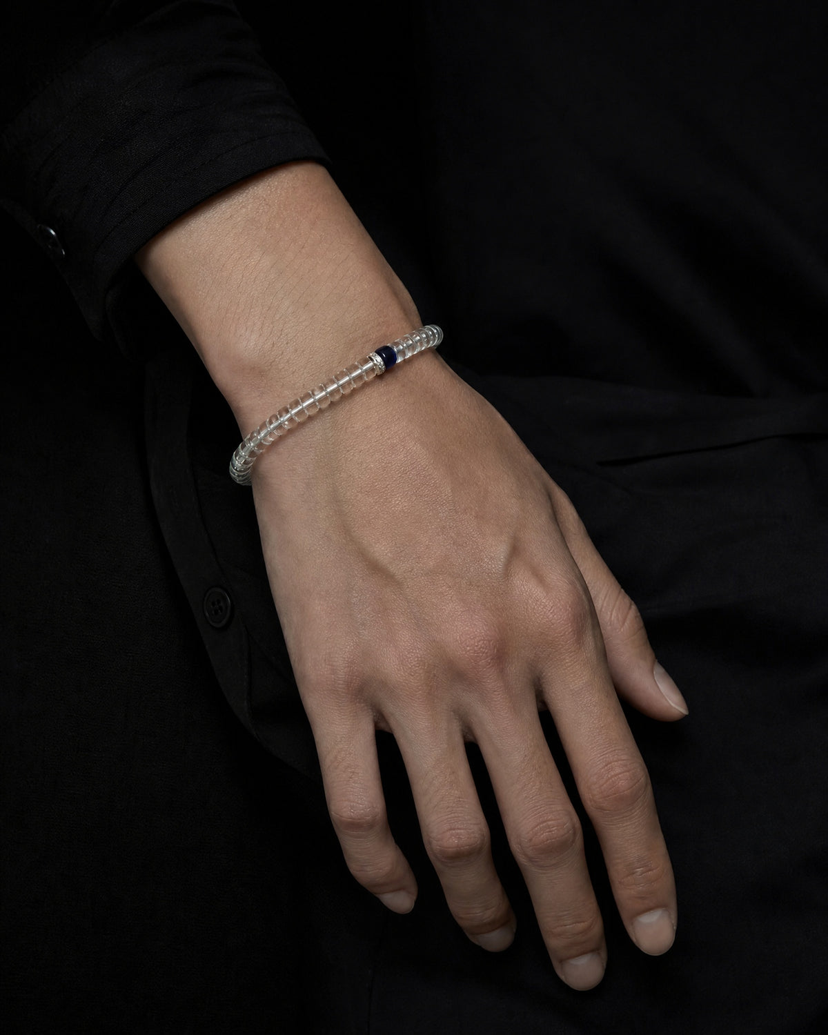 Tide 01 lapis lazuli and clear quartz bracelet worn on wrist