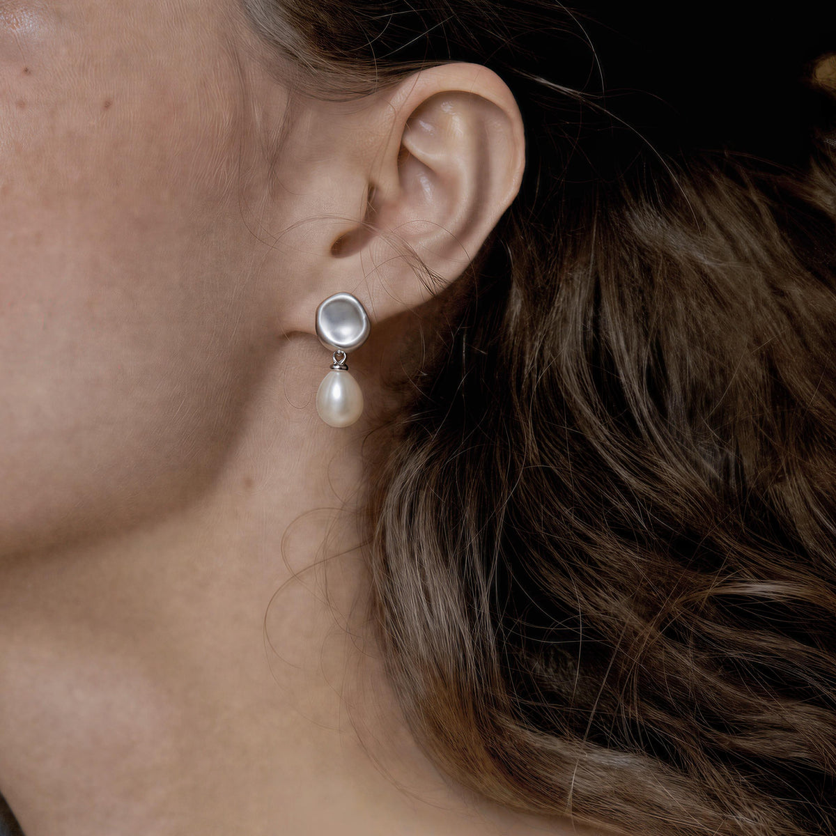 Woman wearing Falling Dew 925 sterling silver freshwater pearl earrings