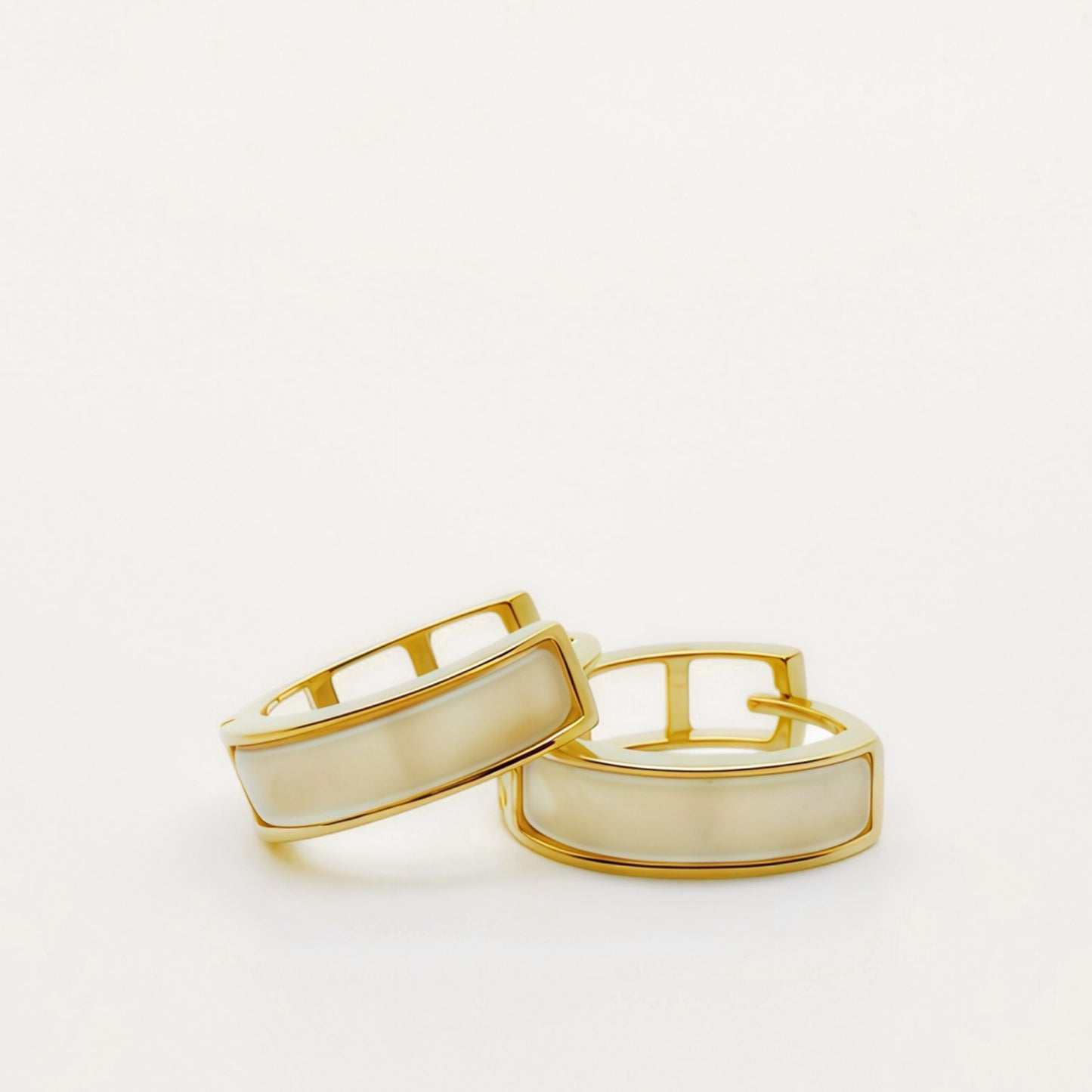 Lunar Hush sterling silver mother-of-pearl hoop earrings.