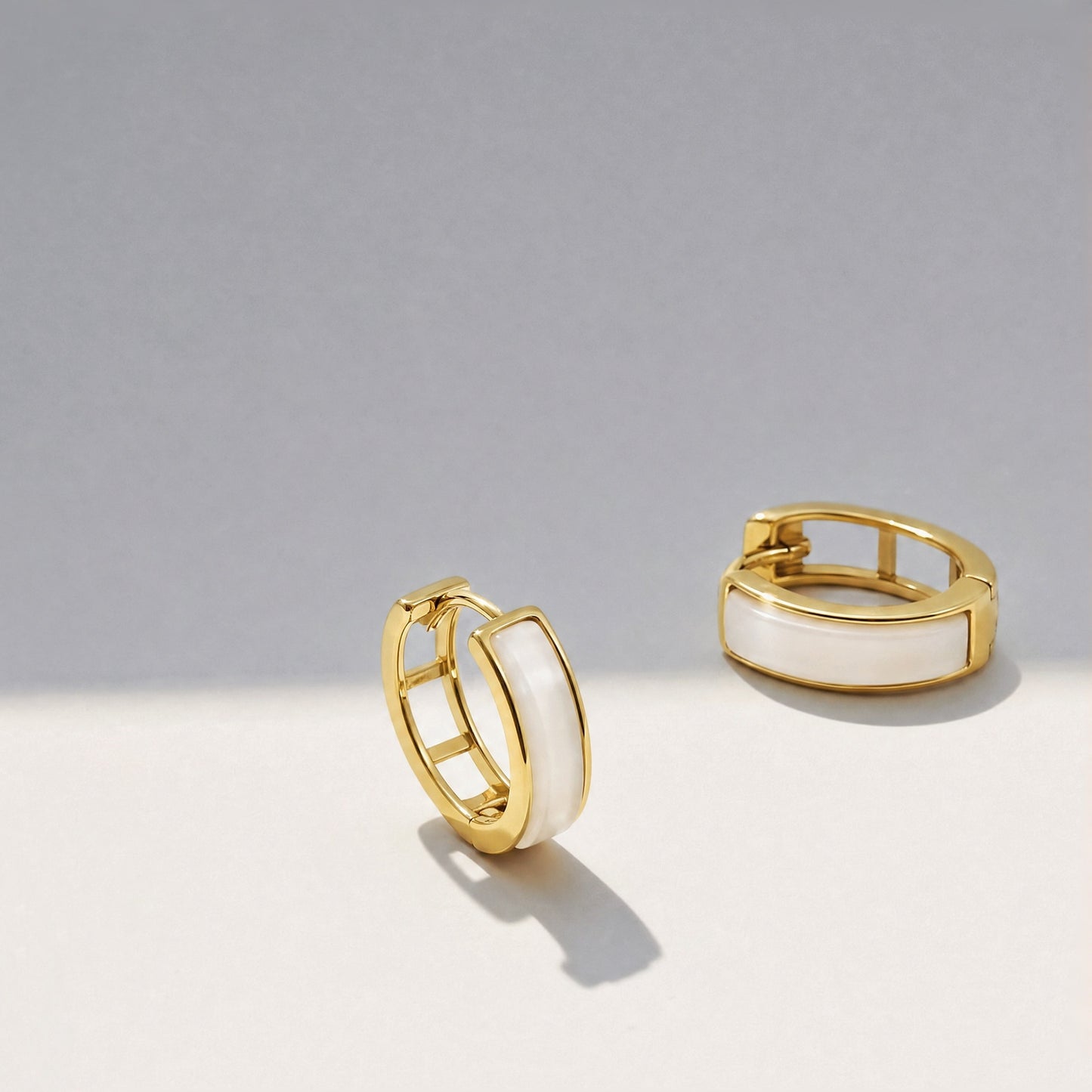 Lunar Hush sterling silver mother-of-pearl hoop earrings.