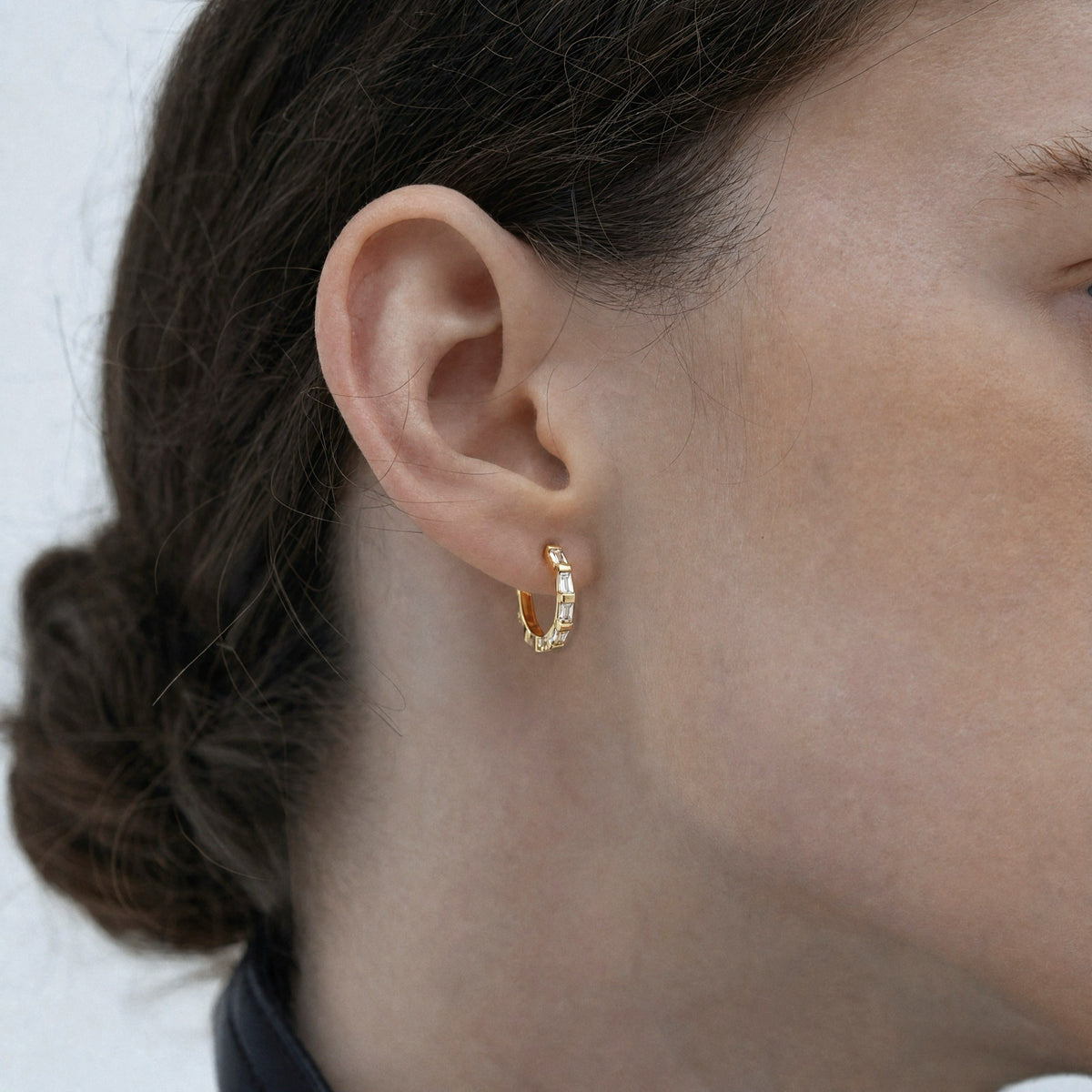 Model wearing Night Kite hoop earrings