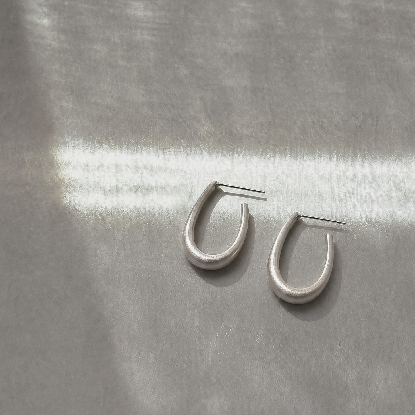 Quiet Loop 925 sterling silver hook earrings by Orin