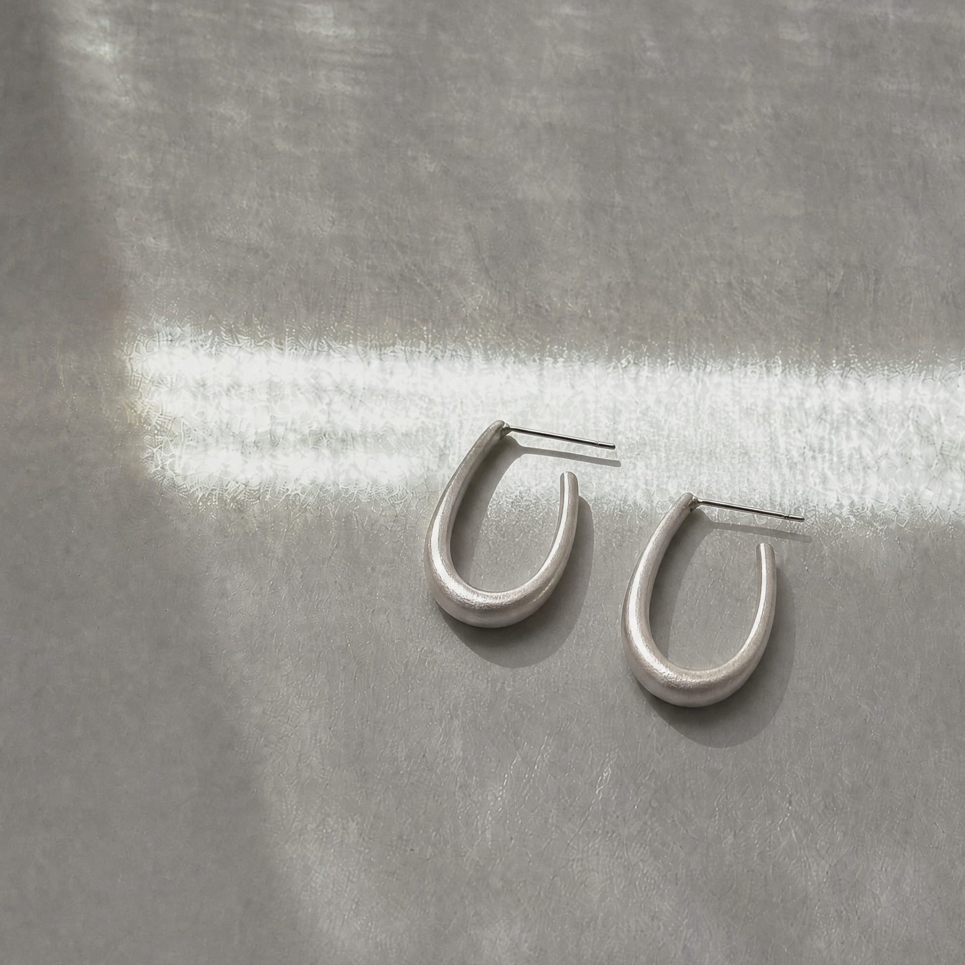 Quiet Loop 925 sterling silver hook earrings by Orin