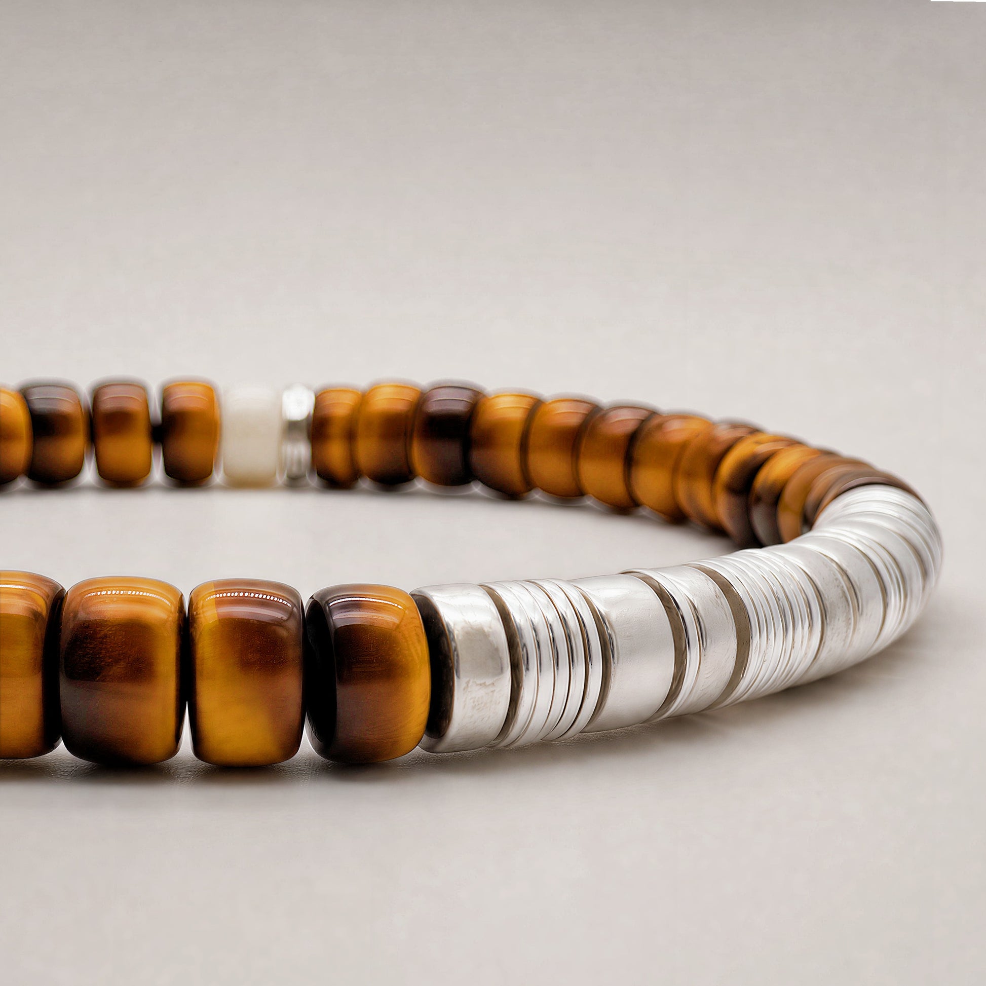 Terra 01 tiger eye and mammoth ivory bracelet detail with sterling silver elements