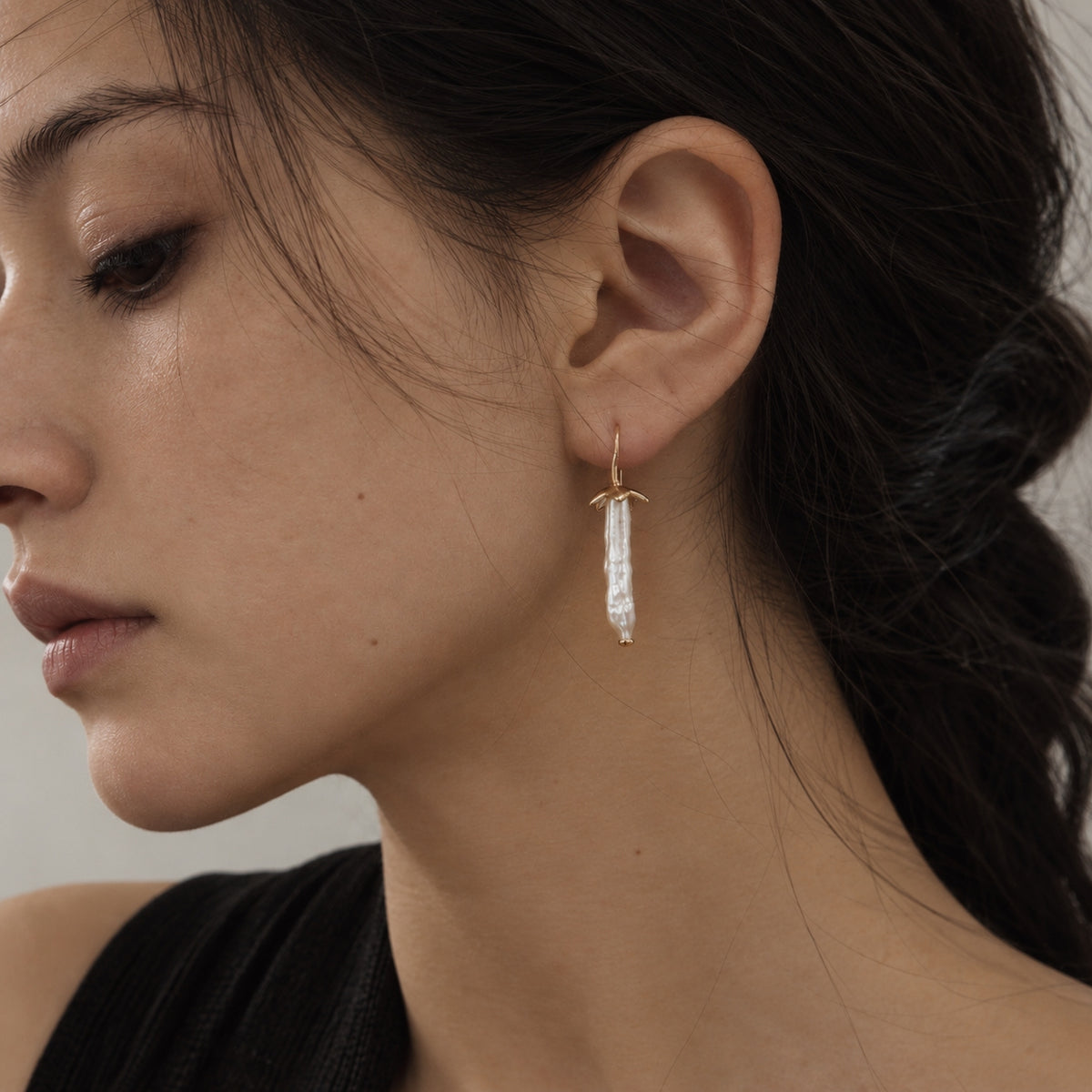 Vesper Light long freshwater pearl drop earring worn by model