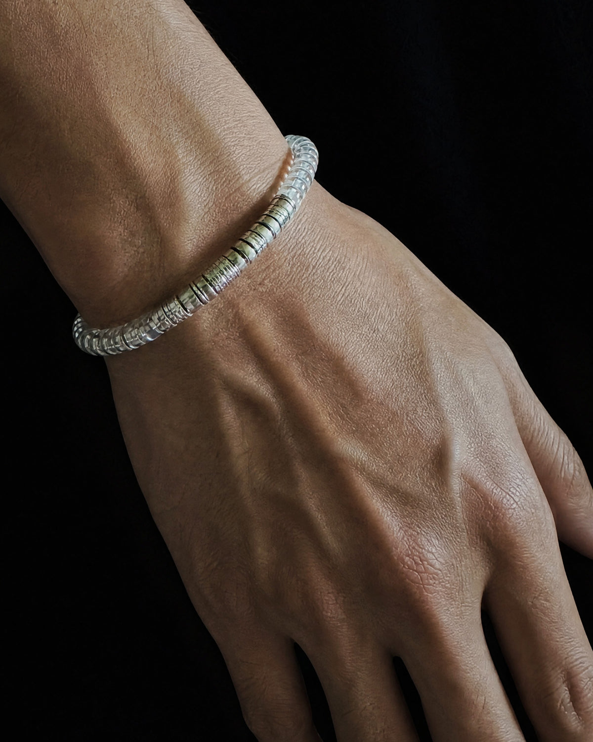 Tide 01 clear quartz bracelet worn on wrist