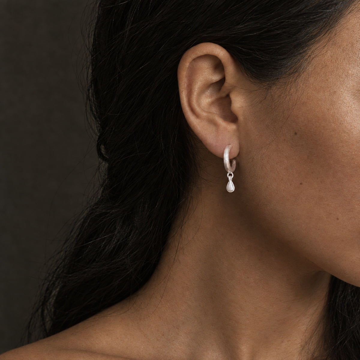 Silent Drop solid S925 sterling silver earrings worn on the ear