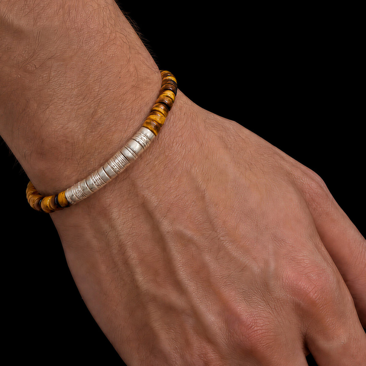 Terra 01 tiger eye and mammoth ivory bracelet worn on the wrist